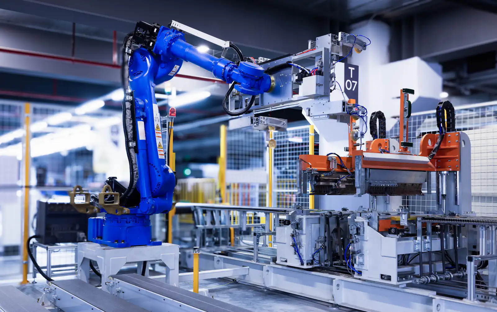 Industrial collaborative robot arm operating on an automated production line