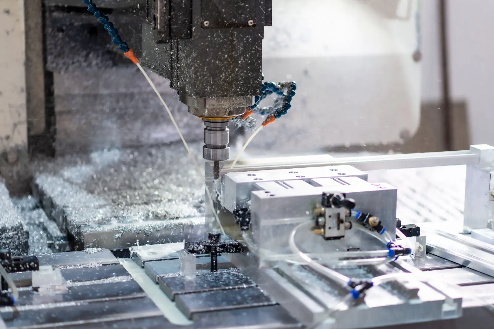 CNC machine cutting a metal component in a precision machining cell